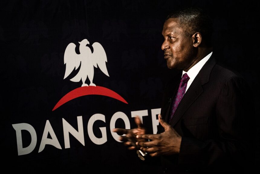 Aliko Dangote, chief executive officer of Dangote Group, gestures after signing a factory construction contract with Sinoma International Engineering Co. Ltd. in Lagos, Nigeria, on Wednesday, Aug. 26, 2015. Dangote Cement has expanded capacity five-fold in the last four years as the company invested outside its home market. Photographer: Tom Saater/Bloomberg