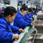 China’s Industrial Production Surges, but Property Sector Remains a Concern