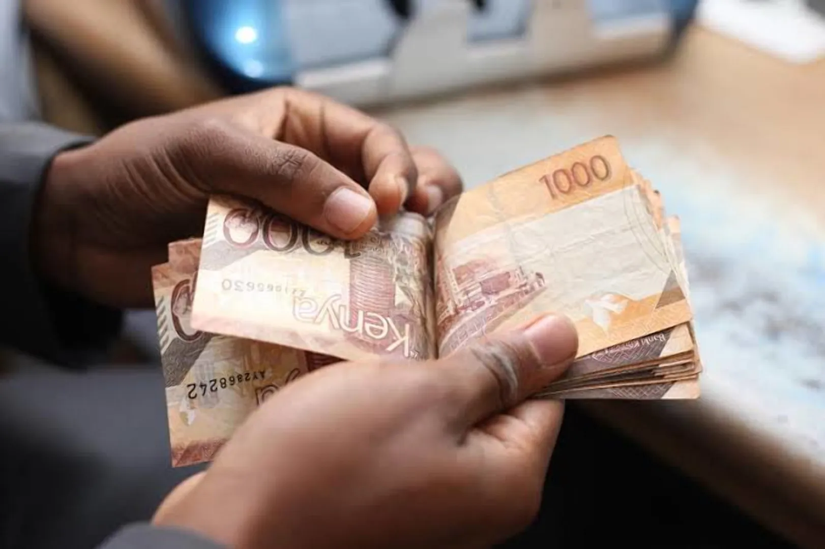 Kenyan investor holding Kenyan shillings