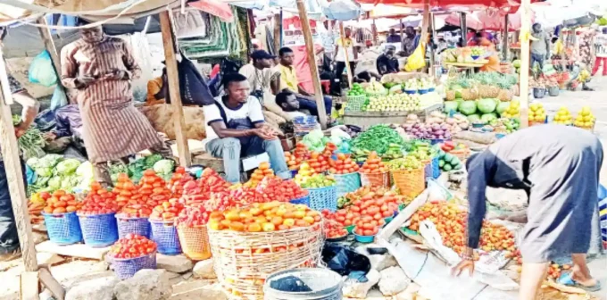 Nigeria's Inflation Drops to 14.45% in November, Achieving Tinubu's Target Amid Rebasing Controversy and Persistent Cost-of-Living Pressures