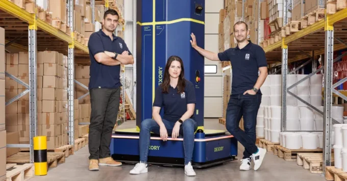 Dexory securing $165 million in funding, with warehouse automation, robotics, and data analytics visuals, highlighting how the investment is reshaping the logistics industry.