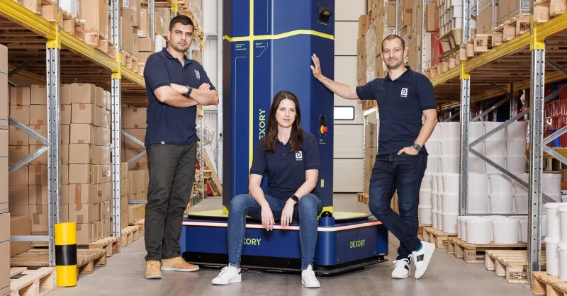 Dexory securing $165 million in funding, with warehouse automation, robotics, and data analytics visuals, highlighting how the investment is reshaping the logistics industry.