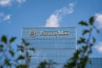 Fannie Mae integrating cryptocurrency into mortgage financing, with visuals of digital coins, housing assets, and blockchain technology signaling a new era in housing finance.