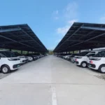 FedEx expanding solar energy use across its logistics network, with warehouses fitted with solar panels and delivery fleets, signaling a new era of sustainable and green logistics.