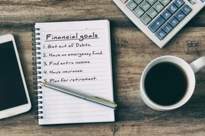 Illustration of clearly defined financial goals with a target, savings jars, and growth charts, representing planning, discipline, and strategic wealth building over time.