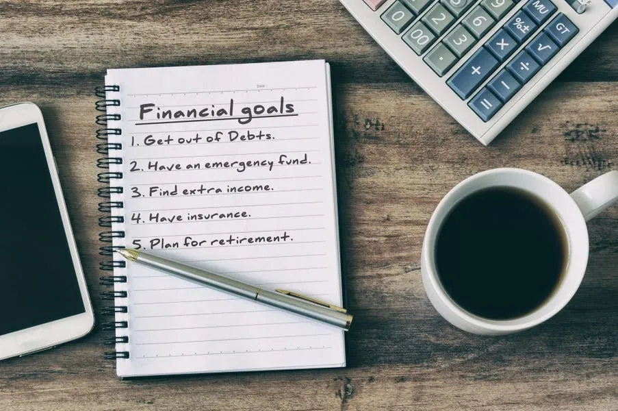 Illustration of clearly defined financial goals with a target, savings jars, and growth charts, representing planning, discipline, and strategic wealth building over time.