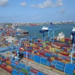 Kenya launching a large-scale marine hub on the coast, featuring port infrastructure, shipping vessels, and industrial development, highlighting initiatives to drive coastal economic growth.