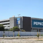 South Africa showcasing strong economic growth driven by established brands, with retail, finance, and market expansion visuals highlighting a R771 billion rise.