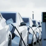 United Kingdom reviewing its electric vehicle mandate with automakers, featuring EV production lines, policy documents, and market charts, highlighting how regulatory changes are reshaping the automotive industry.