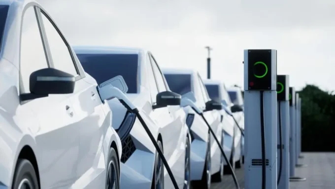 United Kingdom reviewing its electric vehicle mandate with automakers, featuring EV production lines, policy documents, and market charts, highlighting how regulatory changes are reshaping the automotive industry.