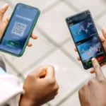 Illustration of mobile money growth with smartphones, digital wallets, and rising revenue charts, showing why 80% of providers are now profitable through scale, transaction volumes, and fintech innovation.