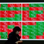 Asian stock markets rise following Wall Street record highs as oil prices decline