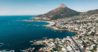 South Africa’s Q1 economic growth exceeding forecasts while highlighting rising risks from inflation, weak demand, and structural economic pressures.