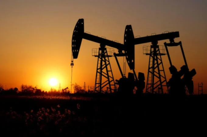 Silhouettes of oil pumpjacks at sunset, representing higher oil prices and their impact on Nigeria’s stock market rally and energy sector performance.