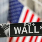 Wall Street slips as the Fed signals another rate hike, highlighting U.S. stocks, Federal Reserve policy, interest rates, and investor sentiment