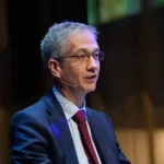 BIS chief warns debt could complicate future crises, highlighting global debt, financial stability, monetary policy, and economic risks